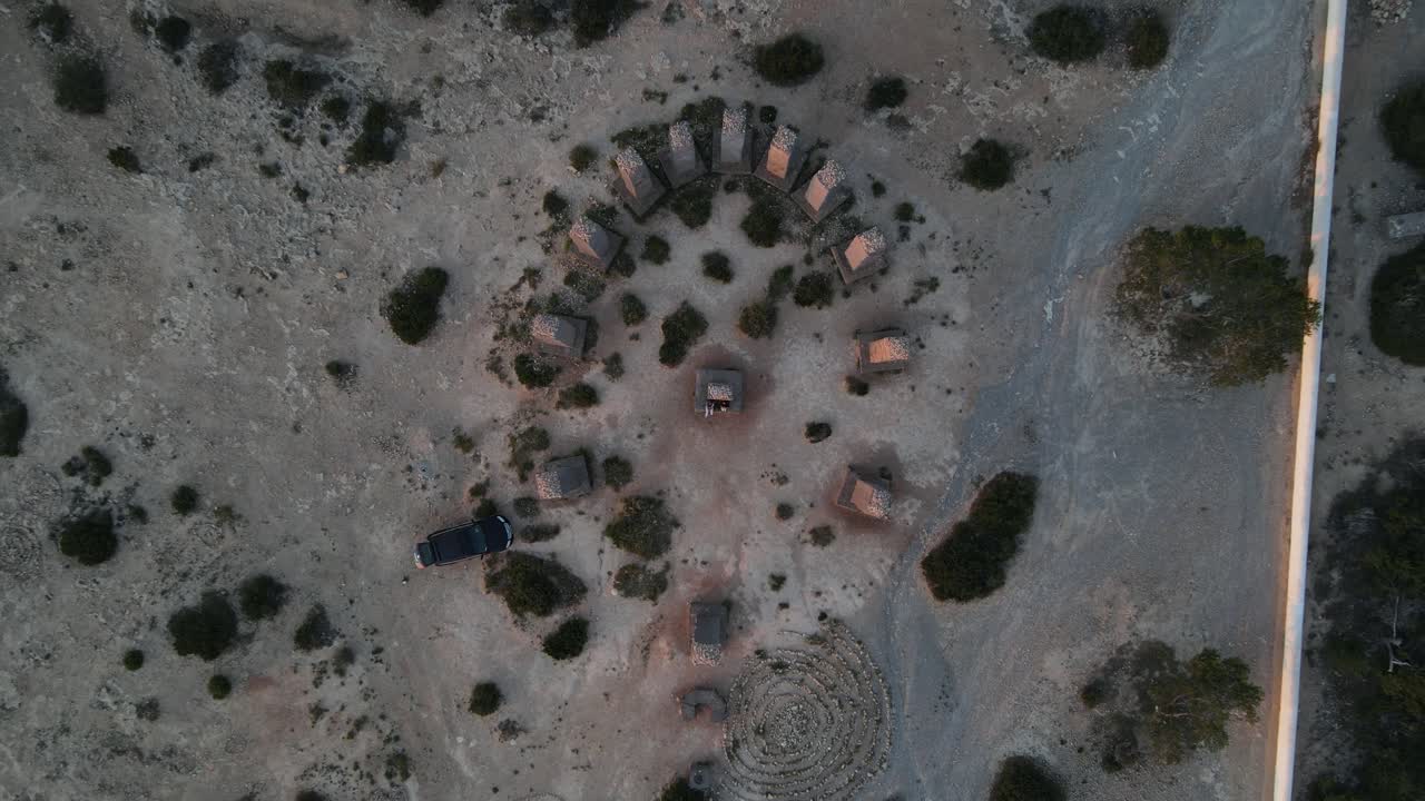 Drone view of historical stone towers in a high area by the sea, historical rock view taken from overhead