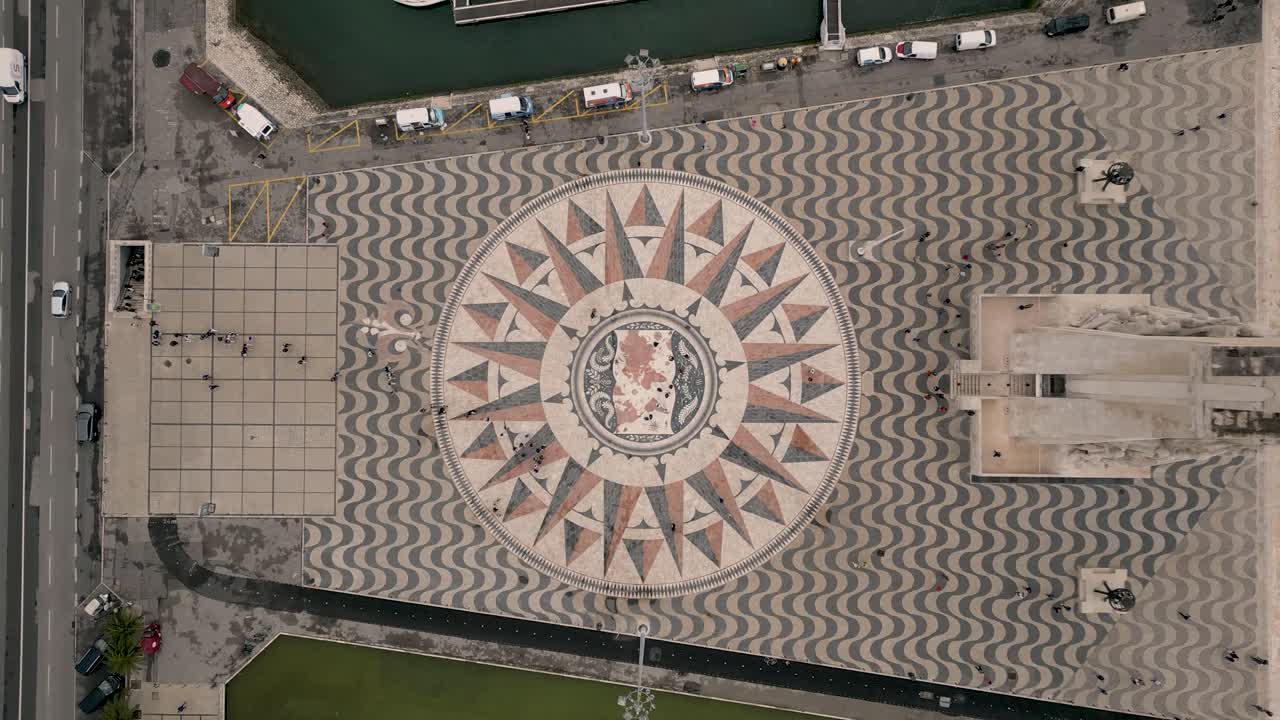 Aerial drone bird's eye view over tourists entering touristic ferry boat before sailing the Tagus river in the center of Lisbon in Portugal at daytime