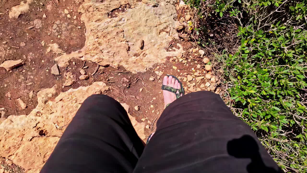 First-Person View of Walking on a Rocky Outdoor Trail