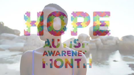 hope autism awareness month animation over person standing near rocky shoreline