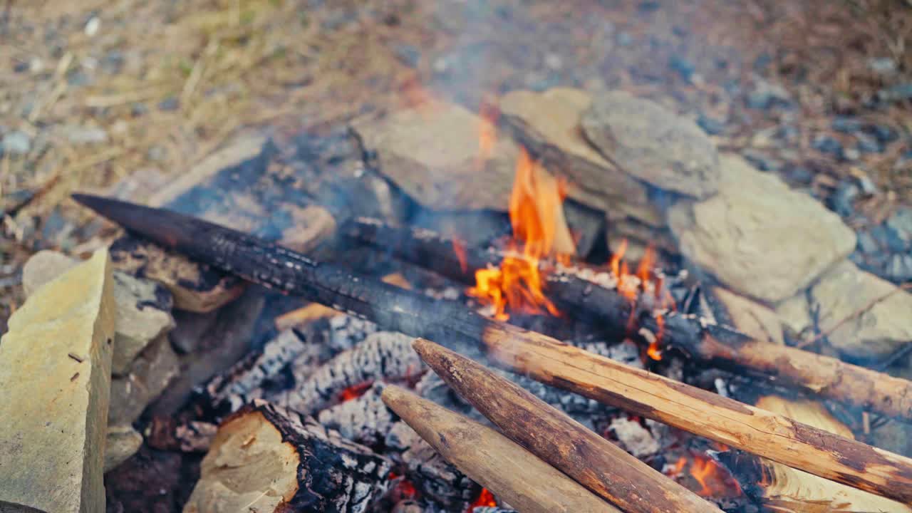 Close Up Of Charred Woods - Burning Wooden Poles For Building Fence