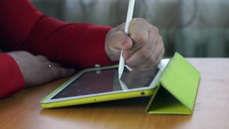 young asian graphic designer working on computer and drawing digital tablet in office studio.