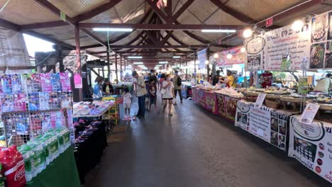 shoppers browsing stalls in a busy market