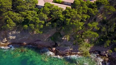 Flying-upward-looking-down-the-cliffside-of-Mediterranean-sea