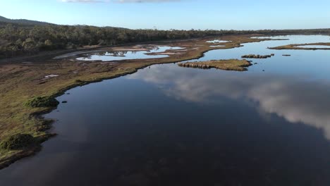 4k60 epic drone view of beautiful rural saltmarch, moulting lagoon in tasmania