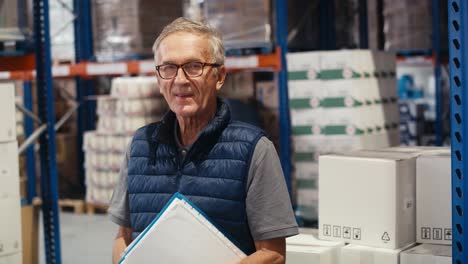 portrait of caucasian mature man in warehouse