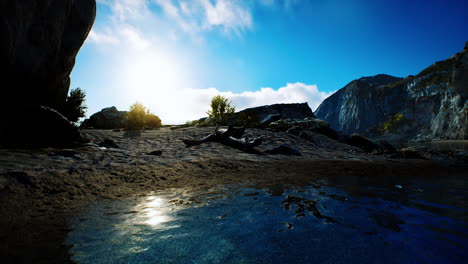 beach-coast-of-the-Norwegian-Sea-with-mountains-and-cliffs-on-sunny-day