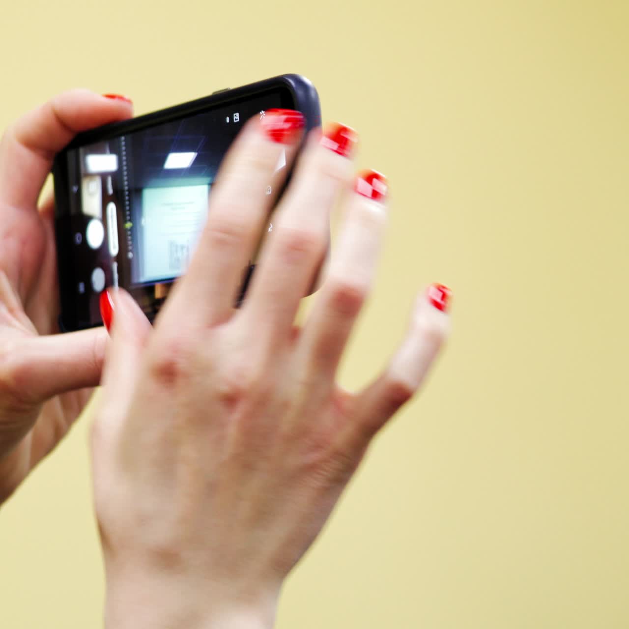 Woman taking photo at conference