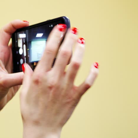 woman taking photo at conference