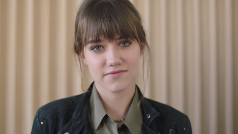 close up portrait of young beautiful woman looking pensive shy at camera cute caucasian female smiling friendly