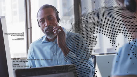 Animation-of-spinning-globe-against-african-american-man-talking-on-phone-headset-at-office