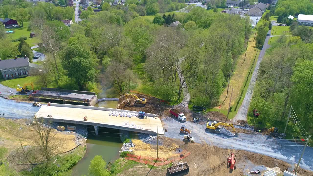 Aerial View of Farmlands and a Bridge being Replaced over a Stream on a Beautiful Sunny Day