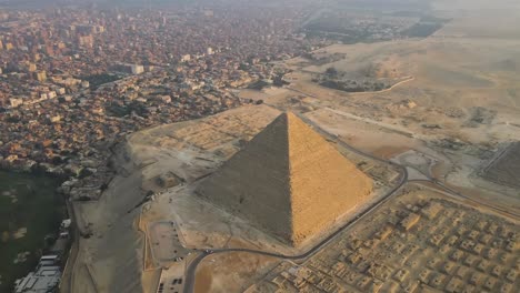 Aerial-perspective-captures-the-Great-Pyramids-of-Giza,-the-Pyramids-Plateau,-and-the-Sphinx-in-Egypt,-embodying-the-concept-of-ancient-marvels-and-cultural-heritage