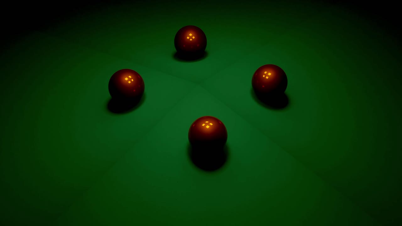 Closeup of four red pool balls on a green felt pool table