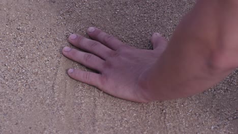 hand on sand