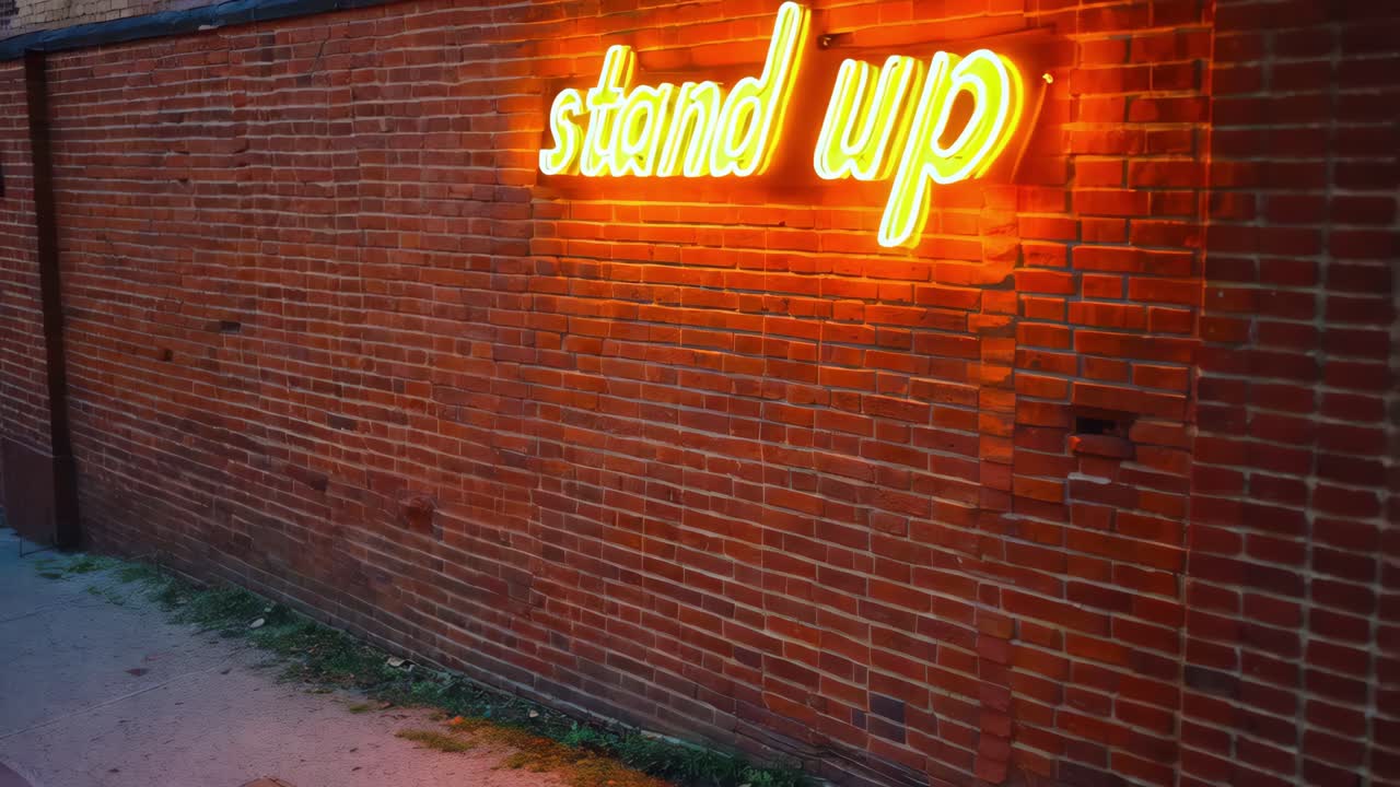 signo de neón motivacional en la pared de ladrillo