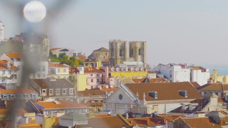 A-view-of-a-town,-houses-and-buildings-over-the-fence-from-the-port-of-Valencia,-Spain