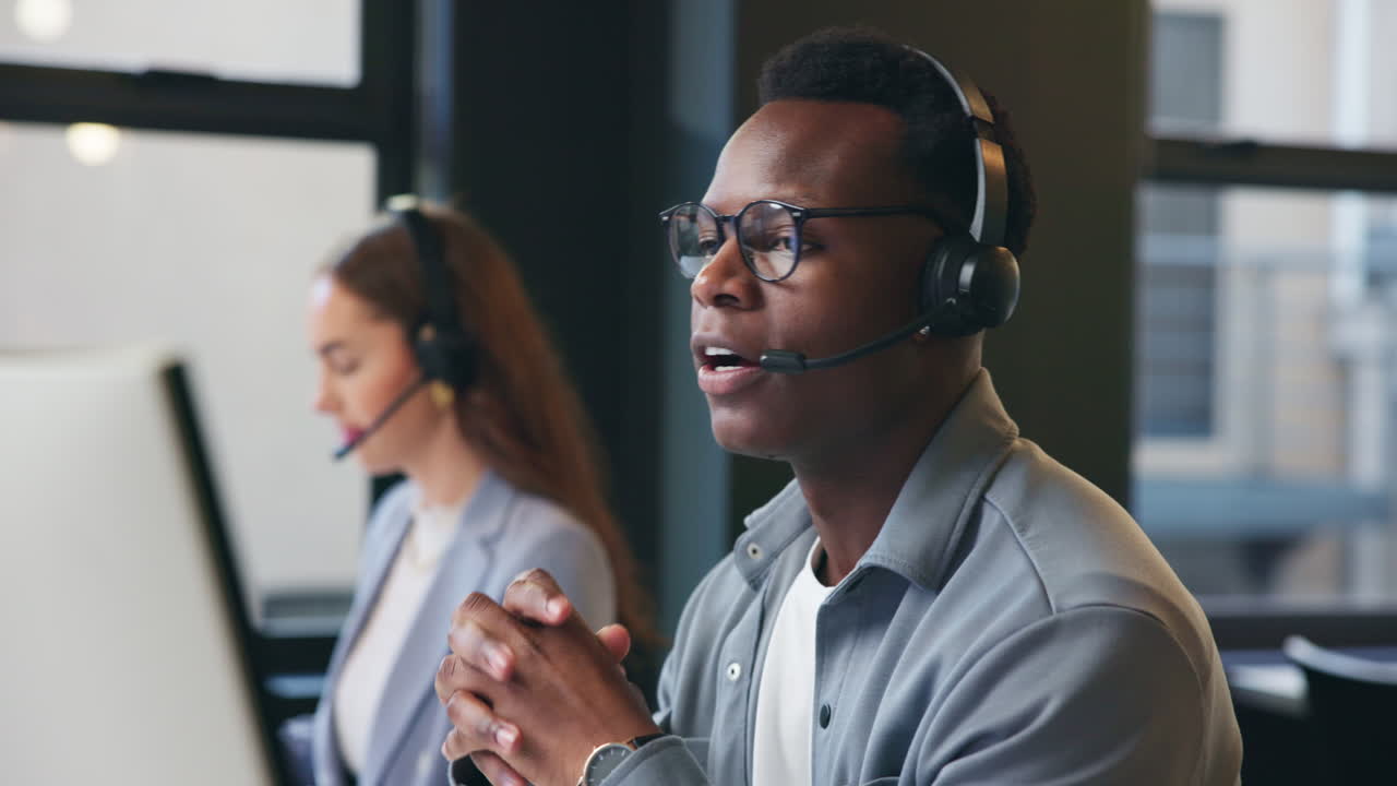 Call center employees working at their desks