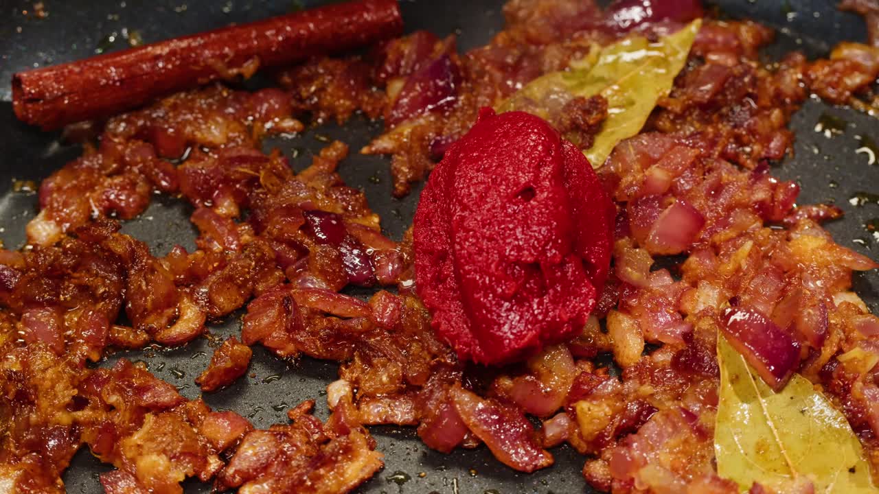 Cooking bacon and tomato paste