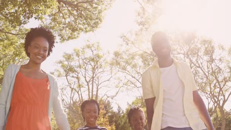 low angle view of cute family is holding by hands