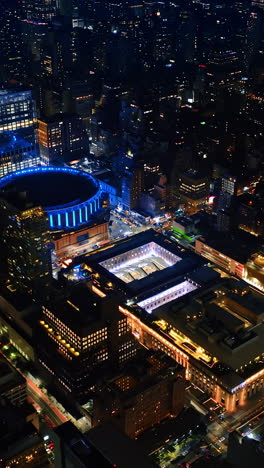 Downcast footage above breath-taking New York at night. Sparkling cityscape of never sleeping metropolis from top. Vertical video