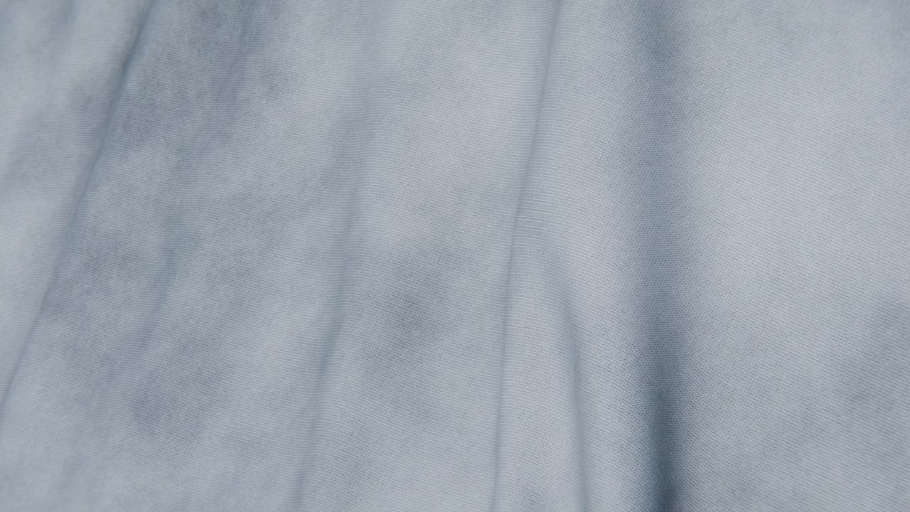 Close-up of Soft Light Blue Fabric with Gentle Movement