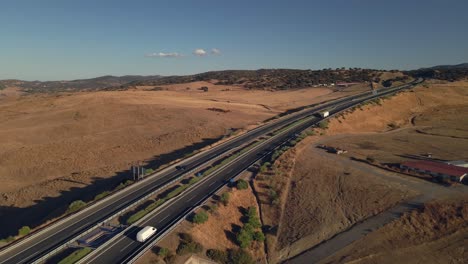 aerial view of an highway at the arid mountains