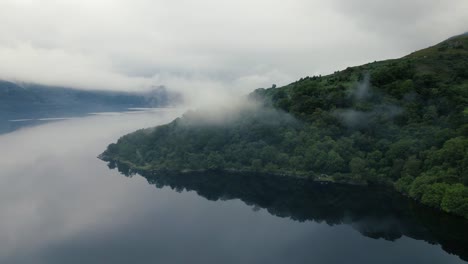 slow motion shot of the beautiful lanscape of the empty island near the mountain range at evening in a natural background of glen coe, loch etive at scotland