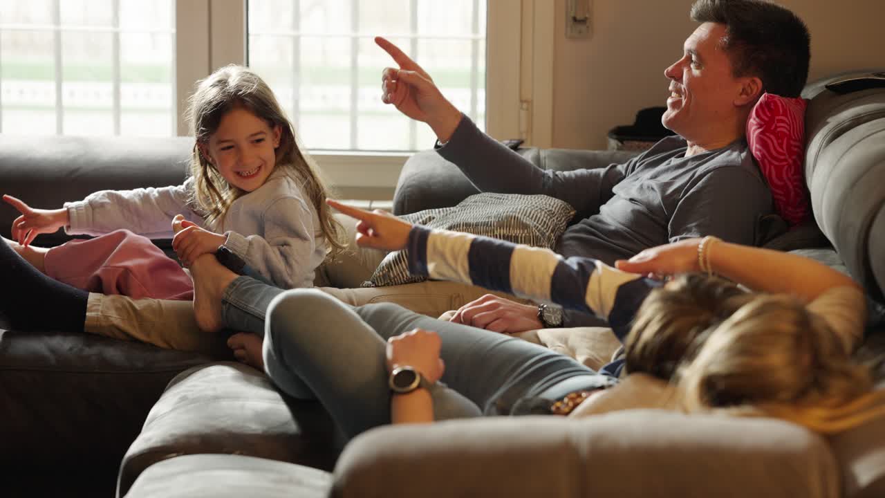 Family Relaxing and Interacting on a Couch