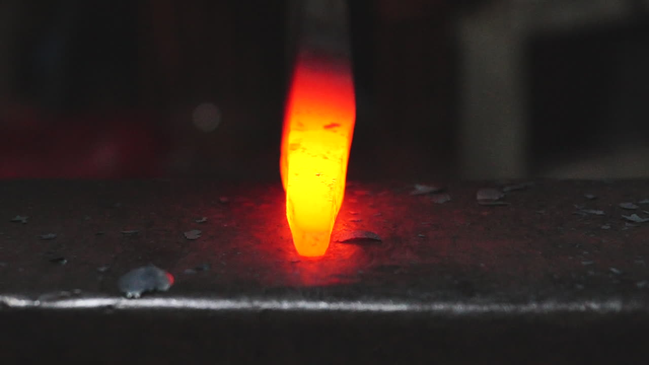 A blacksmith in the process of creating something new