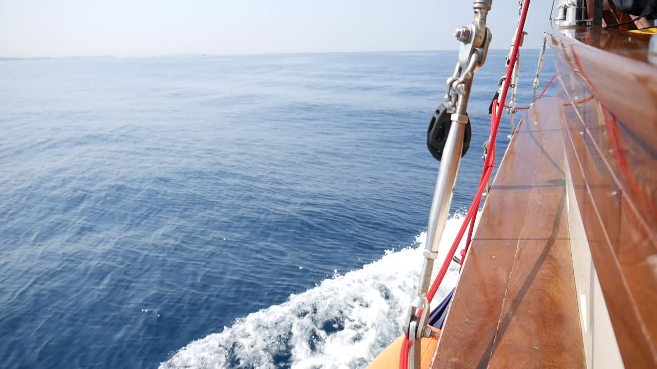 Sailing Turn along the coast of Greece near Athens in the mediterranean sea during a sunny day. Close ups of parts from the ship.