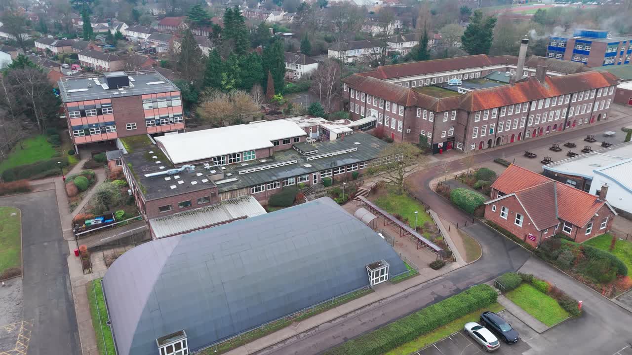 A school complex in bury st edmunds with surrounding greenery, aerial view