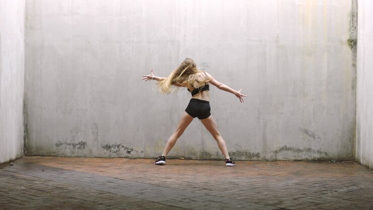 Teenager, gen z dancer dancing in grunge space