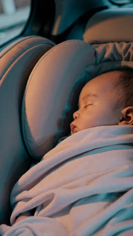 baby sleeping in car seat
