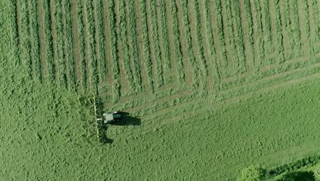 top down aerial of a tractor with an attachement tedder