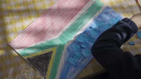 child's drawing of the south african flag with paper pieces