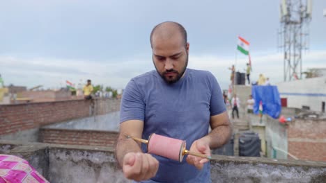 Indian-man-with-kite-Chakri