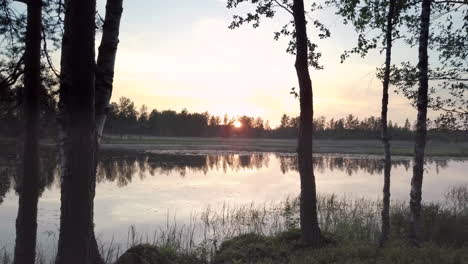 Calm-meditation-style-dolly-forward-to-lakeside-with-nature-reflection-and-sunset