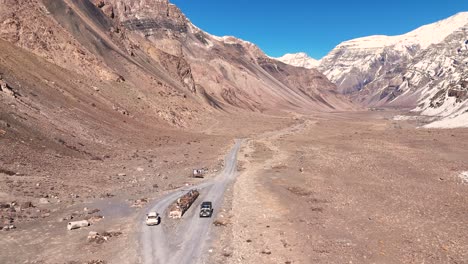 mountain road with trucks and cars