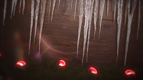 Animated-closeup-red-balls-and-icicles-on-wood-background