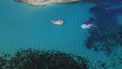 a motor boat cruising in blue lagoon malta