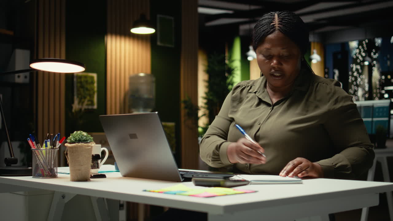 African american woman participates in board meeting video call