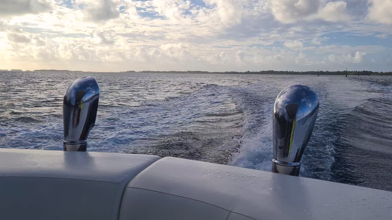 Speedboat Sailing in Bora Bora Lagoon Between Luxury Resort and Main Island After Sunset, Passenger's POV, French Polynesia