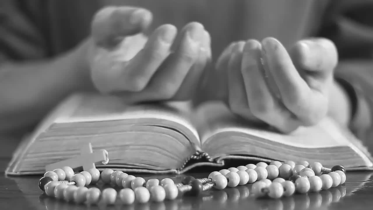 praying to God hands on bible with people stock video stock footage