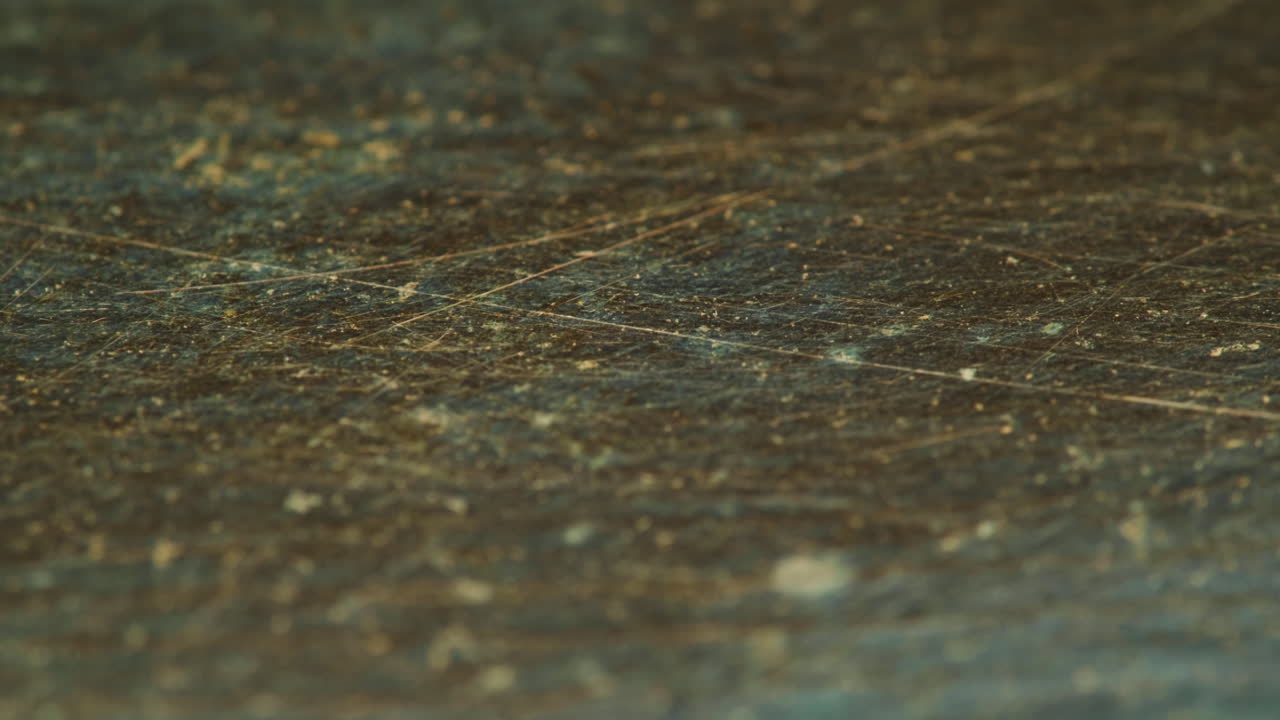 Close-up of a dirty, scratched surface