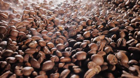 close up of seeds of coffee. fragrant coffee beans are roasted smoke comes from coffee beans.