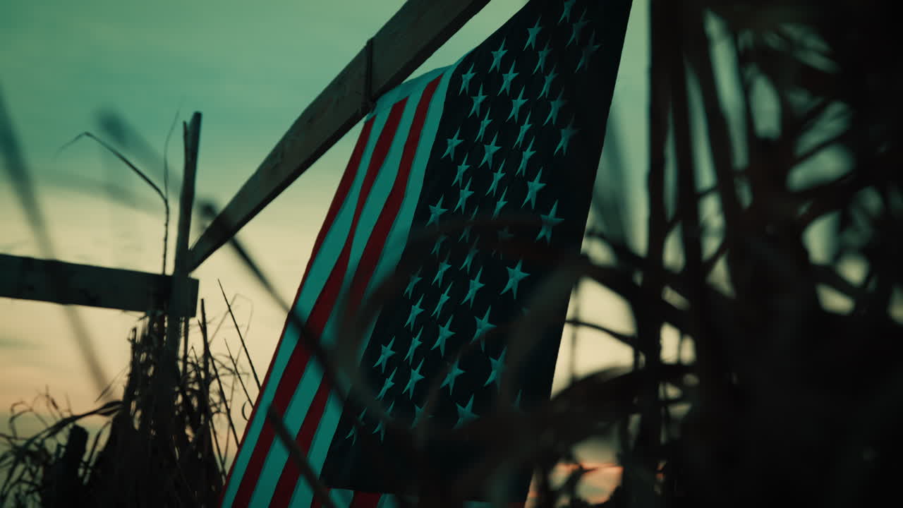 American flag at night in a hut at an outdoor military base outpost