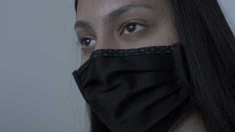 female teenager wearing black cotton face mask