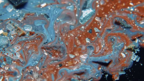 captivating swirls of vivid colors and textures in a liquid medium, showcasing the intricate interaction of particles and pigments in a visually stunning display