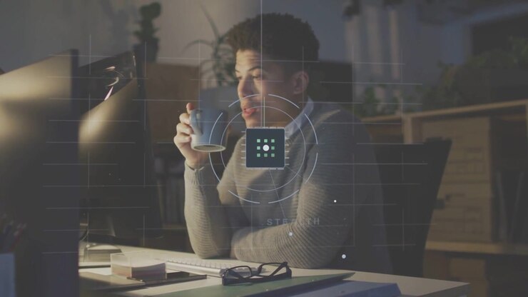 Male tech worker feeling fatigue reaching mug while HUD overlaying man and monitor regaining focus